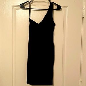Woman’s one shoulder black dress